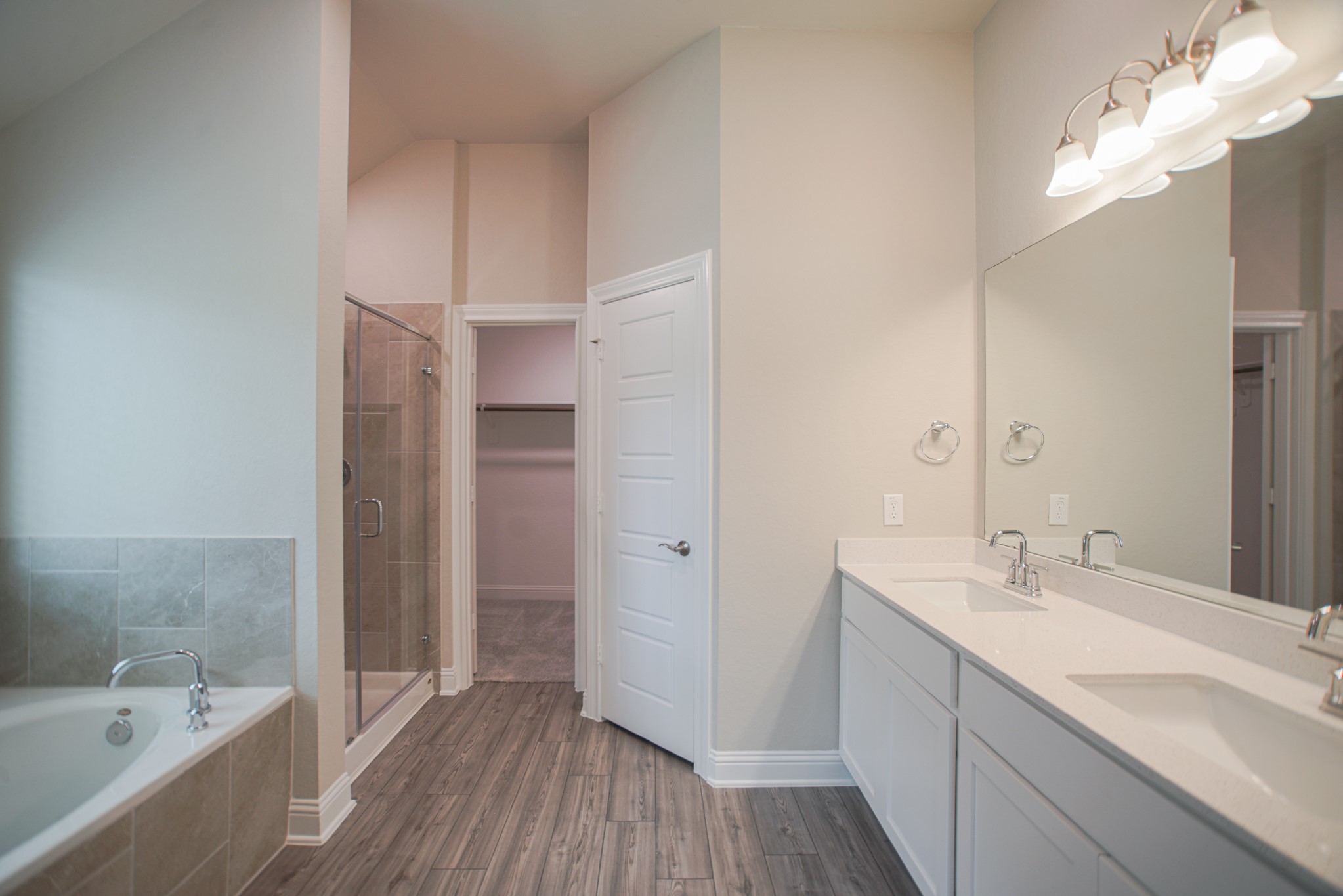 17112 Coneflower Place Conroe, TX 77385 - Photo 16 of 27 a bathroom with a tub sink and mirror