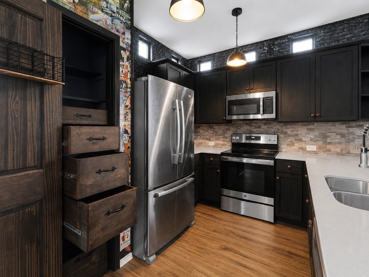 116 Night Riders Way Jarrell, TX 76537 - Photo 17 of 38 A contemporary kitchen offers sleek dark cabinetry with stainless steel appliances and durable hardwood flooring.