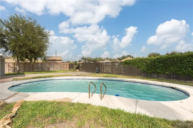 a view of swimming pool with a yard