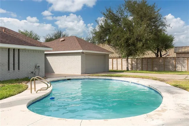 a view of a house with swimming pool