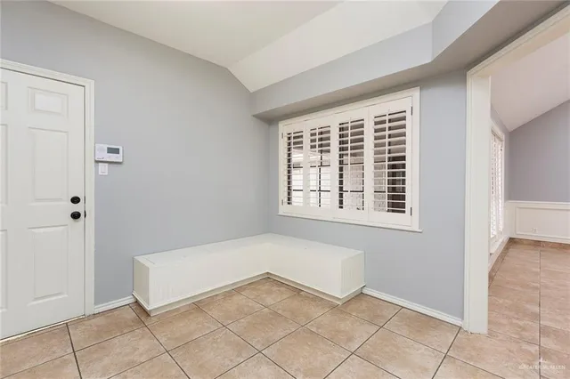 a view of an empty room with windows