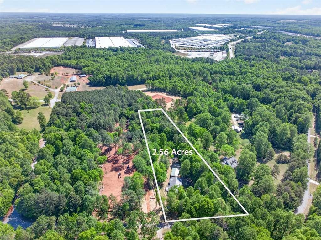 386 Ridgewood Drive Pendergrass, GA 30567 - Photo 2 of 50 an aerial view of a house with a yard lake view and mountain view