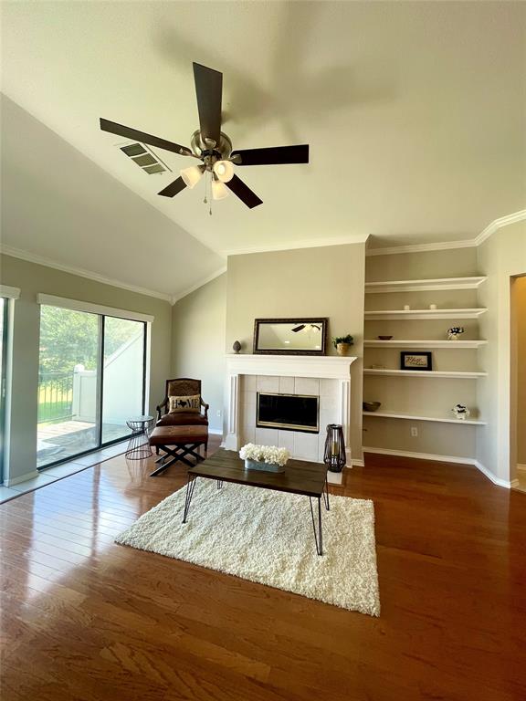 1988 Signal Ridge Place Rockwall, TX 75032 - Photo 5 of 17 Living room with built in bookshelves