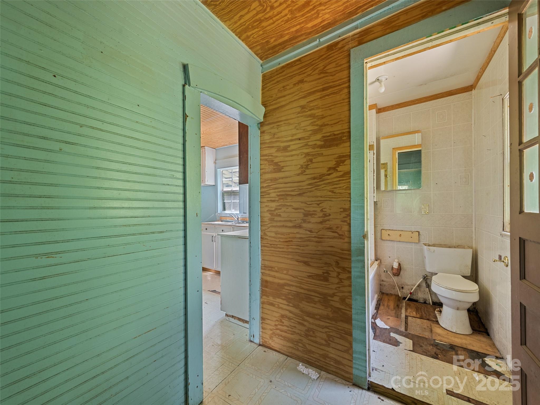 55 Shook Street Clyde, NC 28721 - Photo 20 of 21 a bathroom with a toilet and a shower