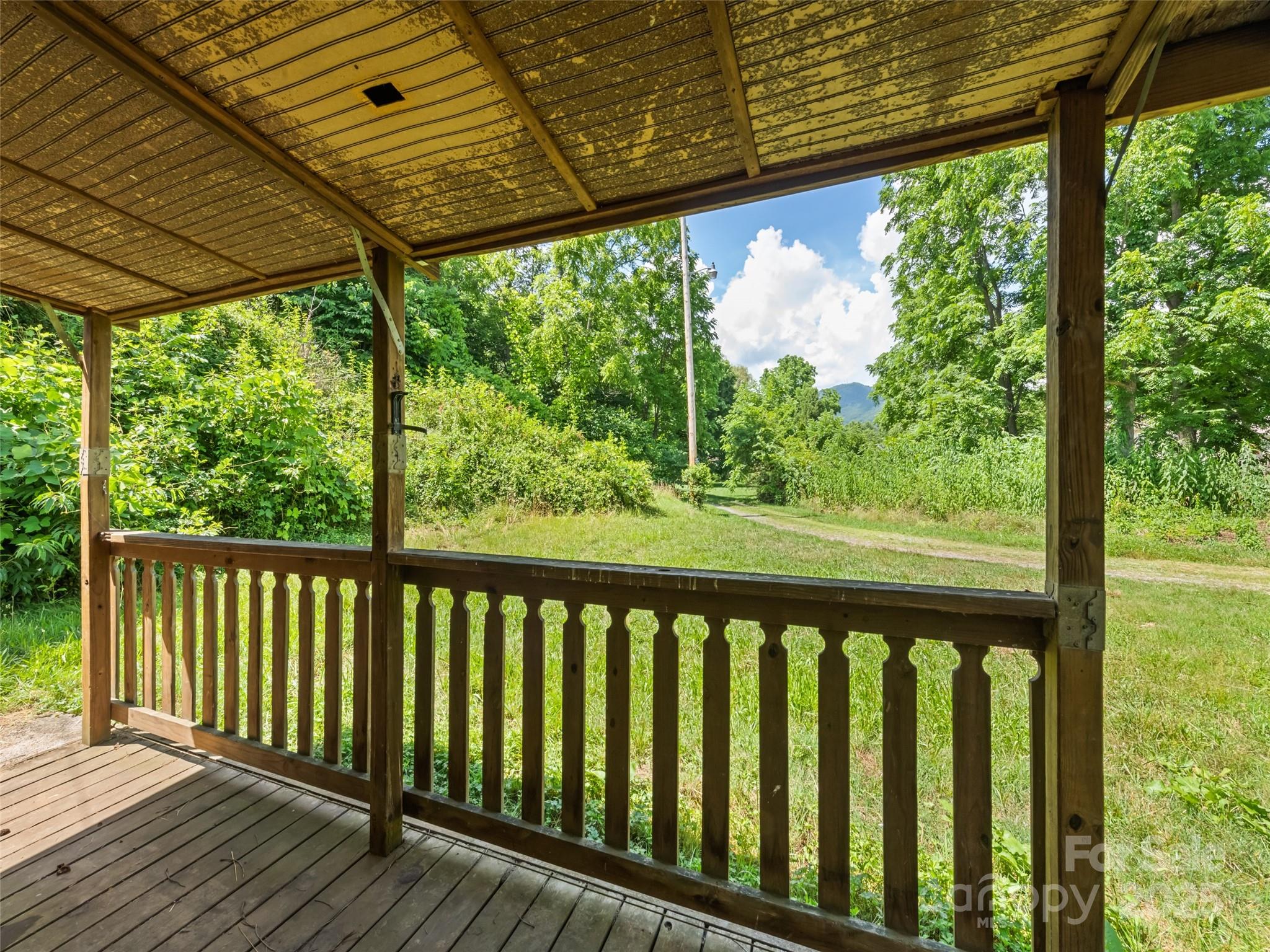55 Shook Street Clyde, NC 28721 - Photo 8 of 21 a view of a wooden deck
