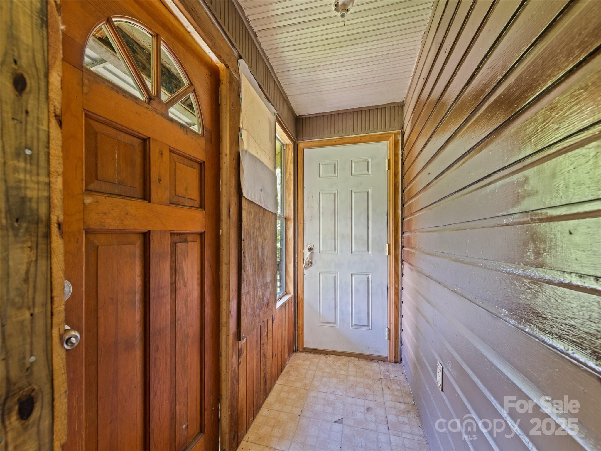 55 Shook Street Clyde, NC 28721 - Photo 10 of 21 a view of a door and wooden door