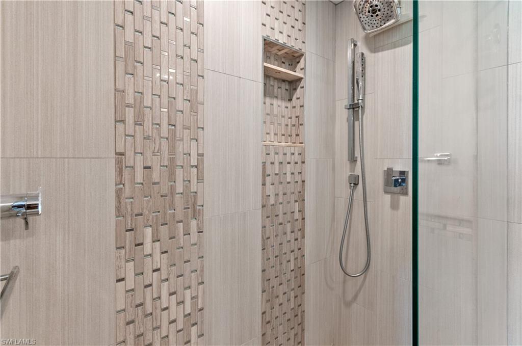 37 High Point Circle East, Unit 210 Naples, FL 34103 - Photo 16 of 29 a bathroom with a shower