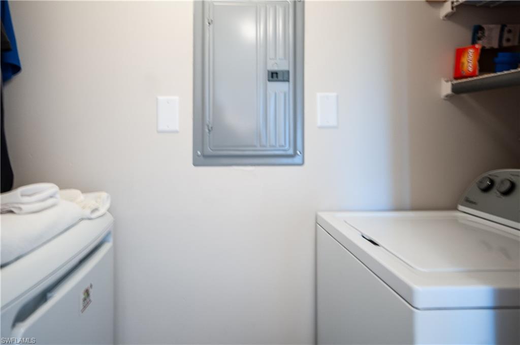 37 High Point Circle East, Unit 210 Naples, FL 34103 - Photo 21 of 29 a utility room with dryer and washer