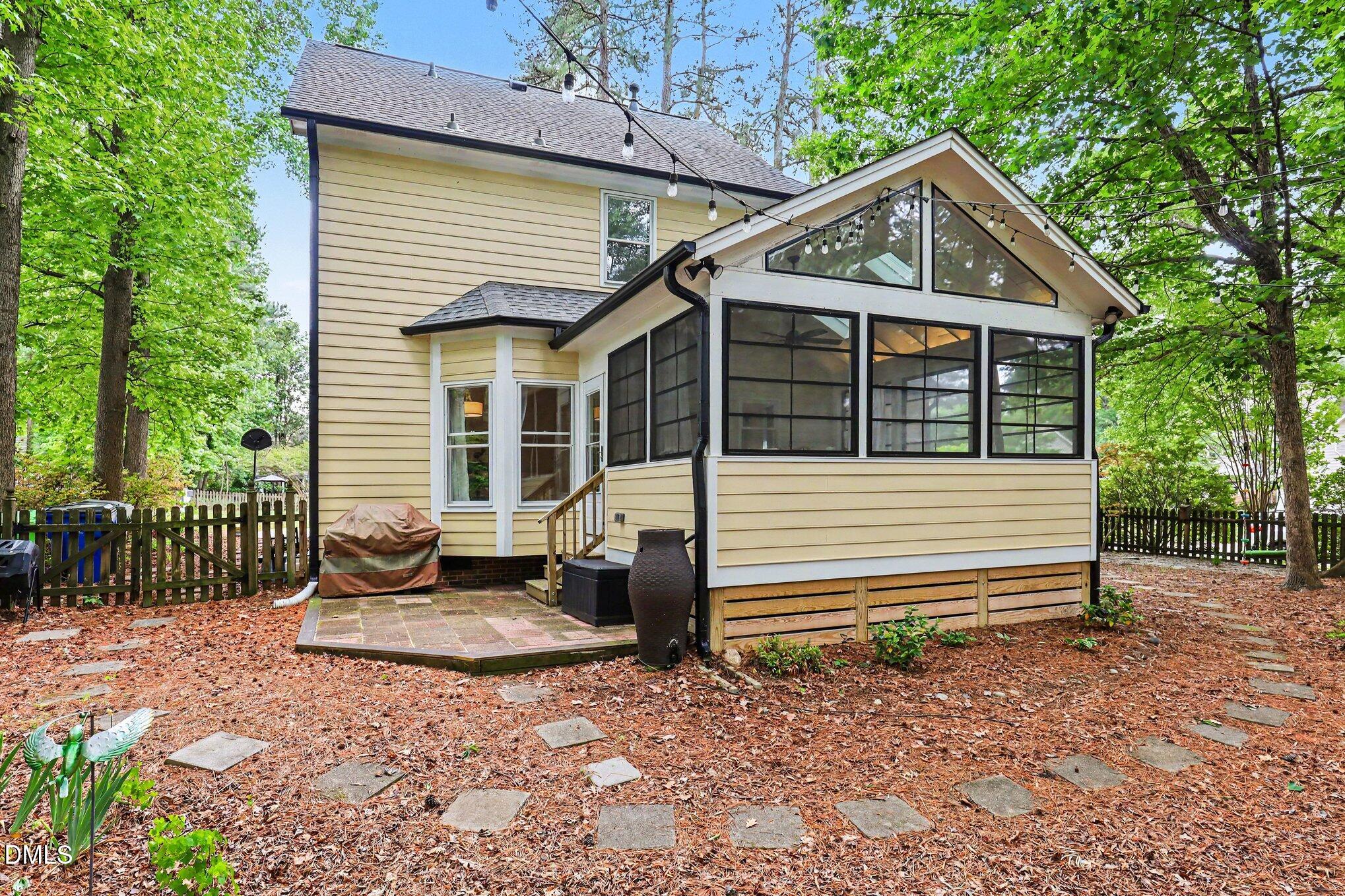 5468 Ingate Way Raleigh, NC 27613 - Photo 23 of 24 a front view of a house with garden