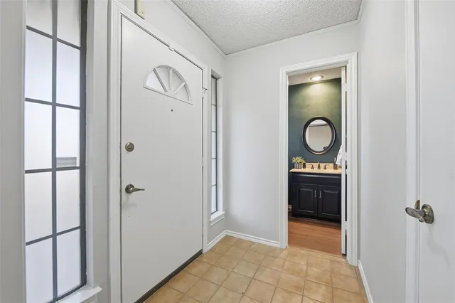 an empty room with mirror door and closet