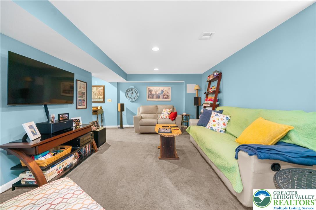5616 Snowdrift Road Orefield, PA 18069 - Photo 25 of 36 A well-lit recreational space offers plush carpeting and ample room for relaxation and entertainment.