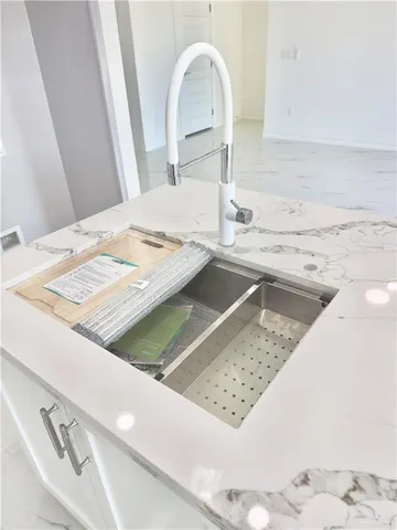 a view of a kitchen sink and a faucet