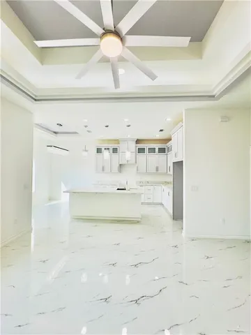 a view of kitchen and empty room