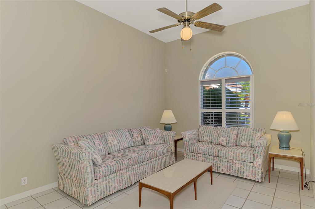 3634 Pennyroyal Road Port Charlotte, FL 33953 - Photo 12 of 91 a living room with furniture and a window