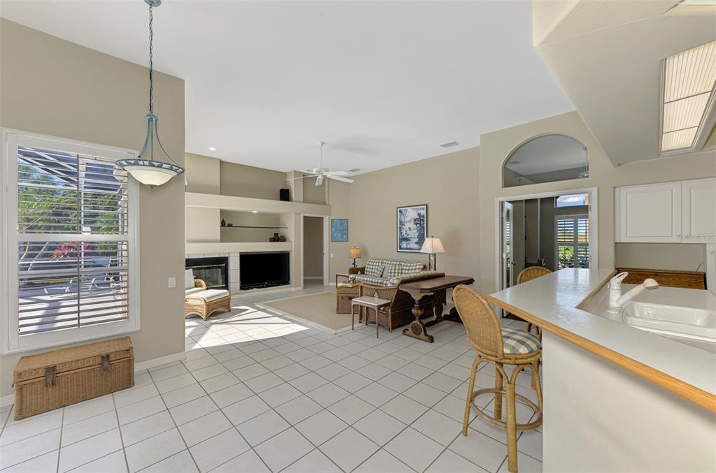 3634 Pennyroyal Road Port Charlotte, FL 33953 - Photo 15 of 91 a living room with furniture a fireplace and a table