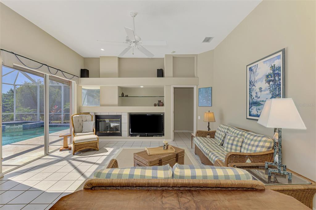 3634 Pennyroyal Road Port Charlotte, FL 33953 - Photo 18 of 91 a living room with furniture fireplace and a flat screen tv
