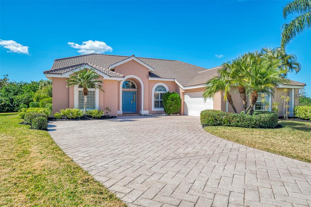 3634 Pennyroyal Road Port Charlotte, FL 33953 - Photo 2 of 91 a front view of a house with a yard