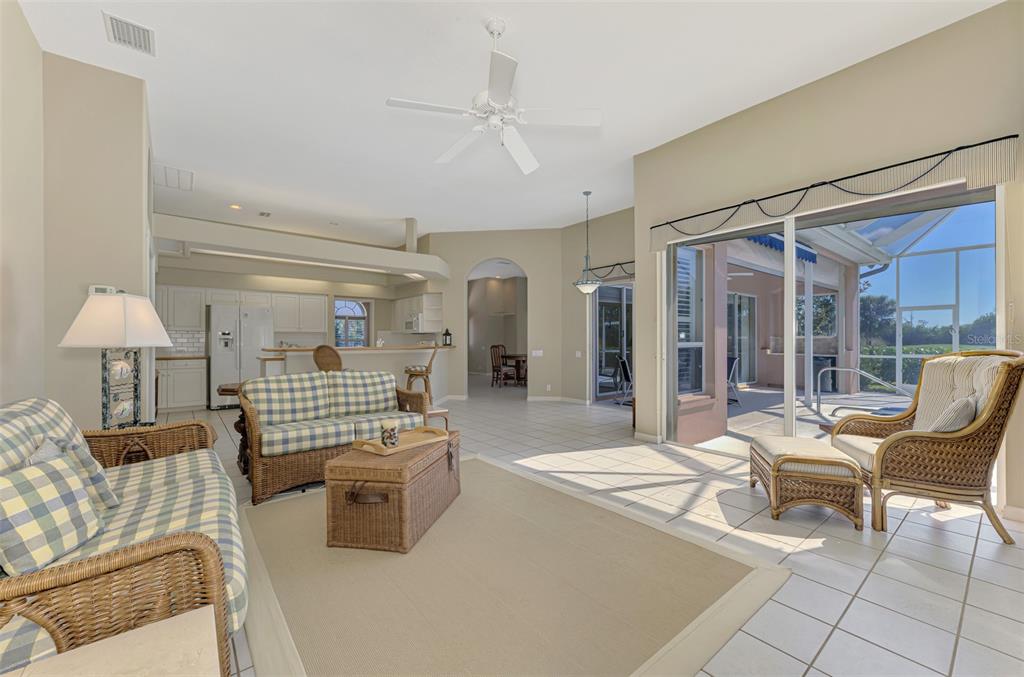 3634 Pennyroyal Road Port Charlotte, FL 33953 - Photo 21 of 91 a living room with furniture and a chandelier