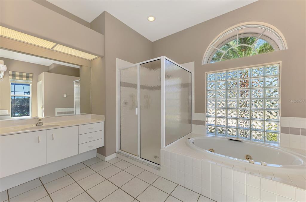 3634 Pennyroyal Road Port Charlotte, FL 33953 - Photo 35 of 91 a bathroom with a bathtub a sink and a shower