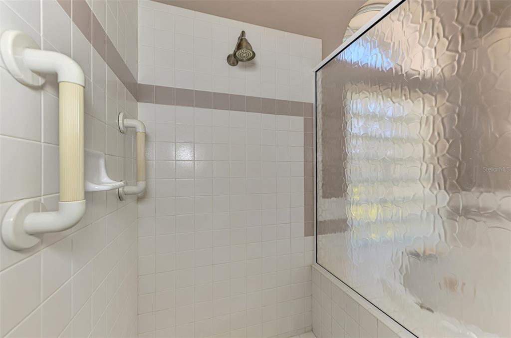 3634 Pennyroyal Road Port Charlotte, FL 33953 - Photo 36 of 91 a bathroom with a shower and a tub