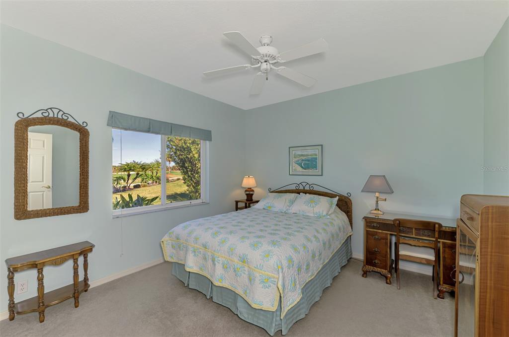 3634 Pennyroyal Road Port Charlotte, FL 33953 - Photo 40 of 91 a bedroom with a bed and a chandelier