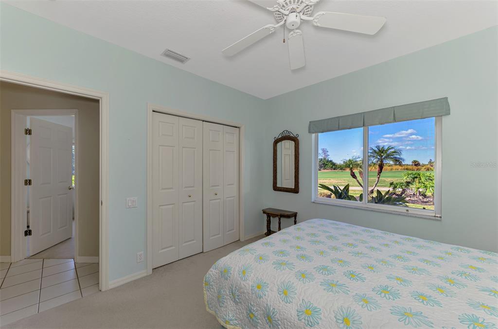 3634 Pennyroyal Road Port Charlotte, FL 33953 - Photo 41 of 91 a spacious bedroom with a bed and a painting on the wall