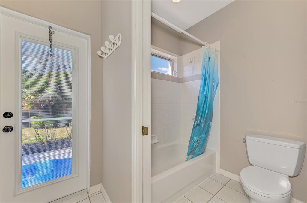 3634 Pennyroyal Road Port Charlotte, FL 33953 - Photo 44 of 91 a bathroom with a toilet and a shower