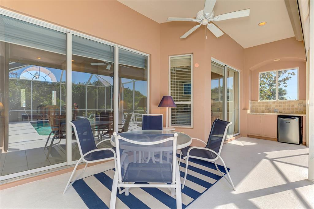 3634 Pennyroyal Road Port Charlotte, FL 33953 - Photo 48 of 91 a view of a dining room with furniture wooden floor and a chandelier