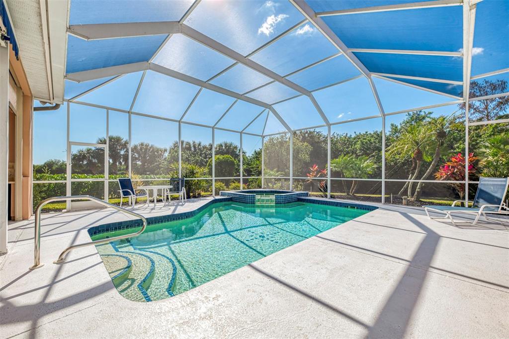 3634 Pennyroyal Road Port Charlotte, FL 33953 - Photo 50 of 91 a view of a backyard with couches chair and umbrella