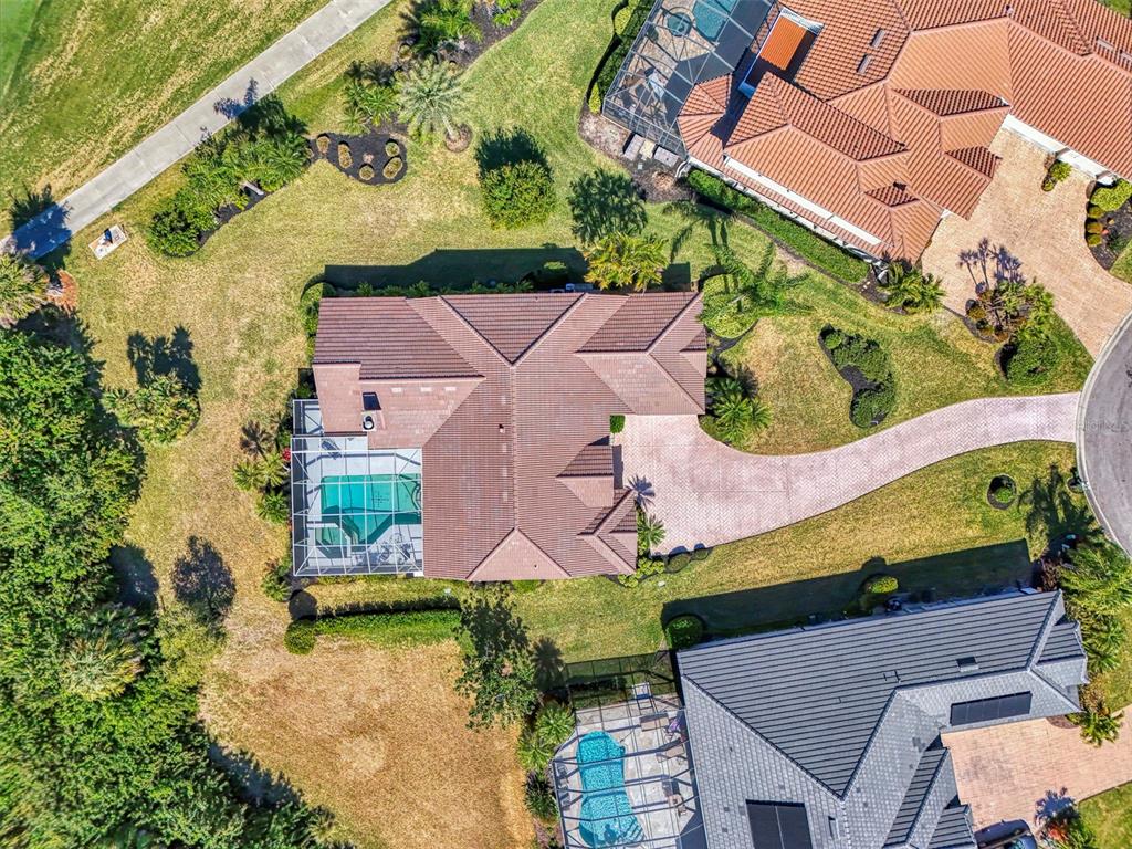 3634 Pennyroyal Road Port Charlotte, FL 33953 - Photo 60 of 91 an aerial view of a house with a yard and pool