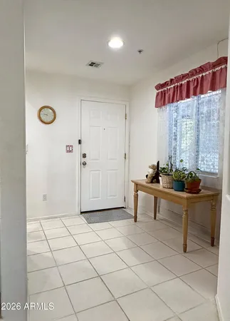 a view of a livingroom with furniture and window