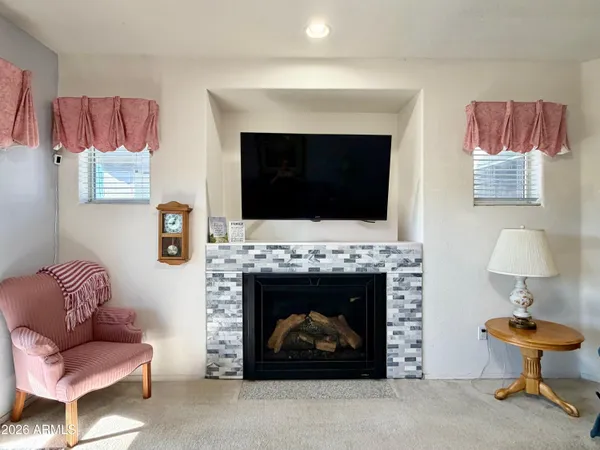a living room with furniture and a rug