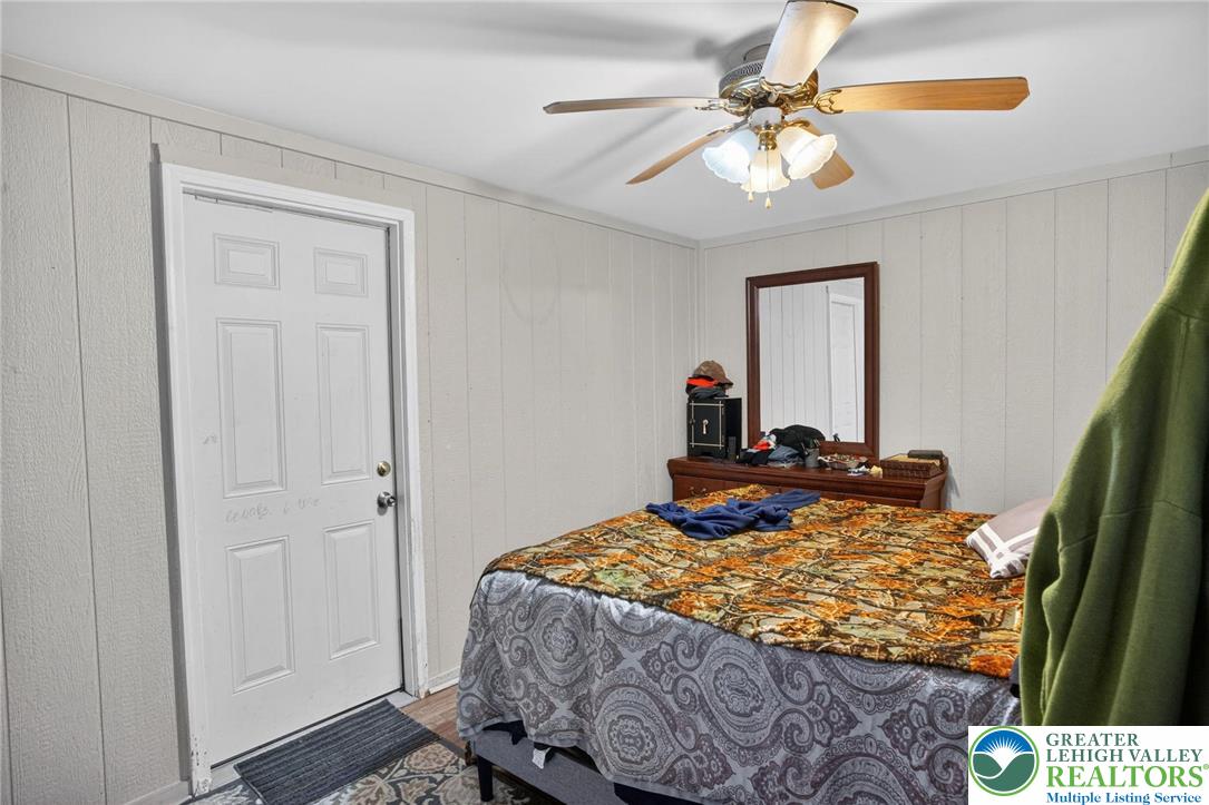 357 Main Road Lehighton, PA 18235 - Photo 34 of 38 a bedroom with a bed and a chandelier