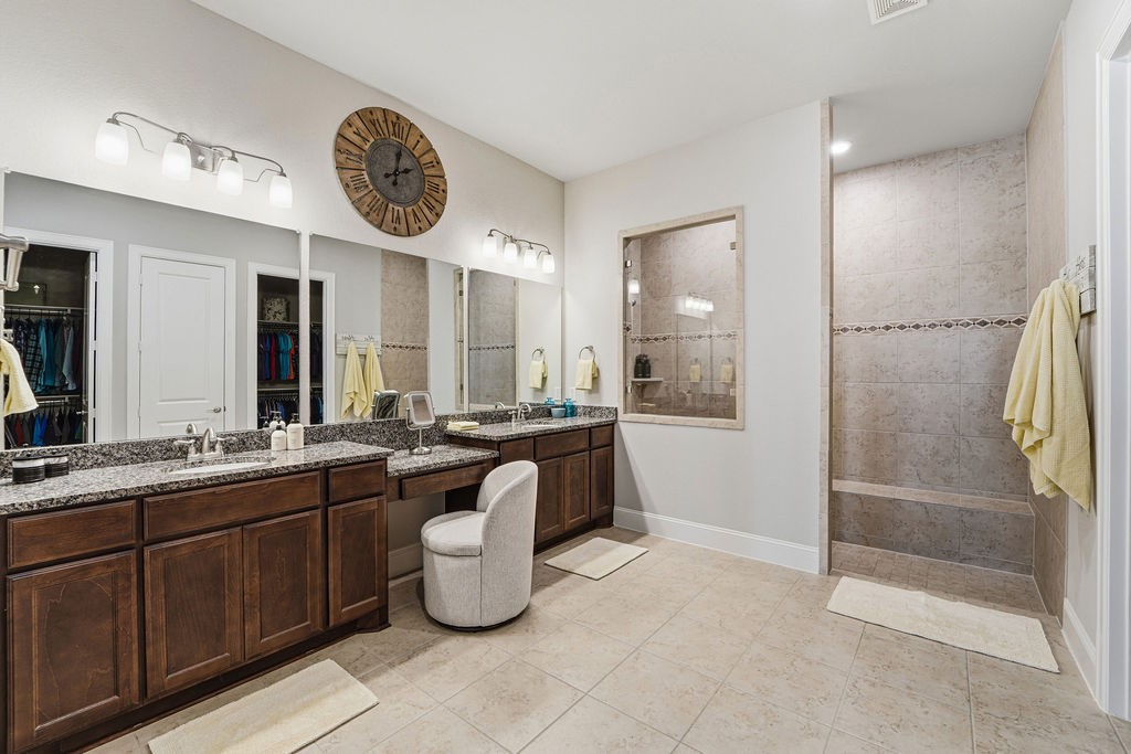 3618 Edison Lane Iowa Colony, TX 77583 - Photo 21 of 50 a large bathroom with a granite countertop sink mirror and bathtub