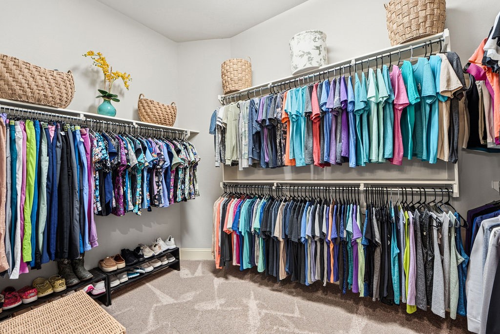 3618 Edison Lane Iowa Colony, TX 77583 - Photo 24 of 50 a view of walk in closet with clothes and shoes