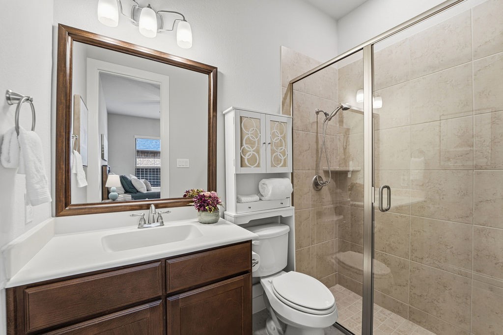 3618 Edison Lane Iowa Colony, TX 77583 - Photo 27 of 50 a bathroom with a sink a toilet and shower