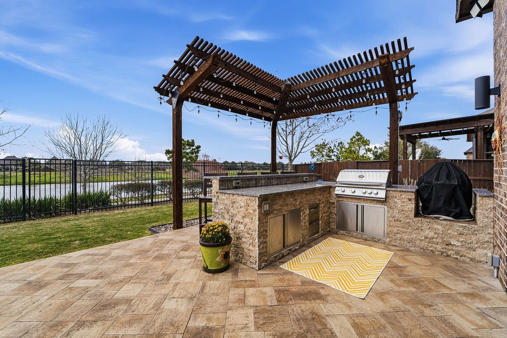 3618 Edison Lane Iowa Colony, TX 77583 - Photo 40 of 50 a view of a patio with a table and chairs