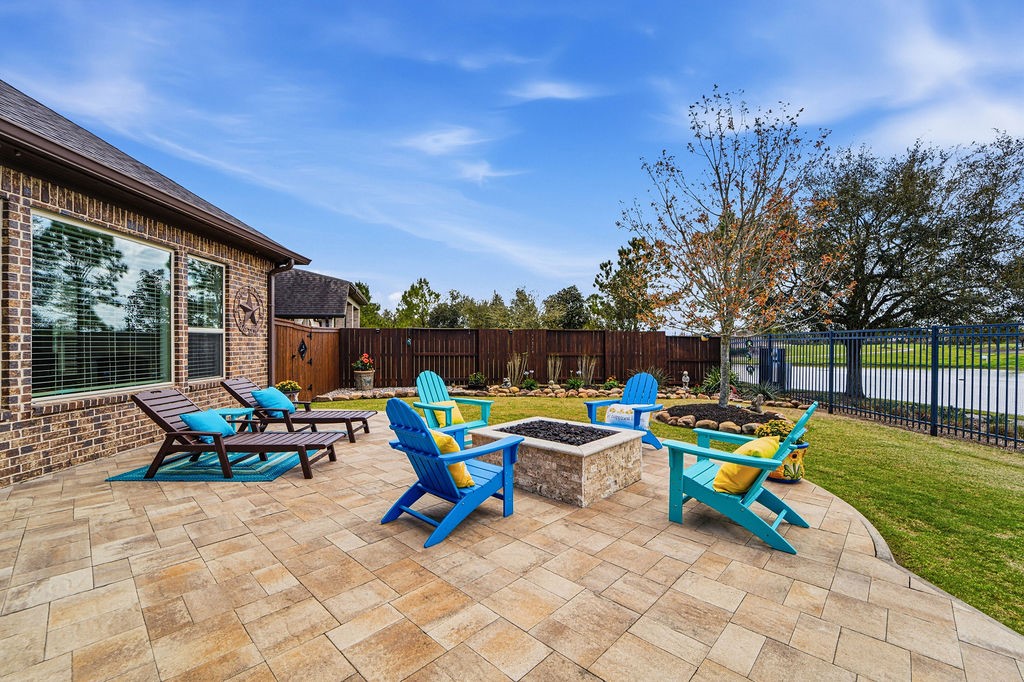 3618 Edison Lane Iowa Colony, TX 77583 - Photo 43 of 50 a view of a chairs and table in patio with a fire pit