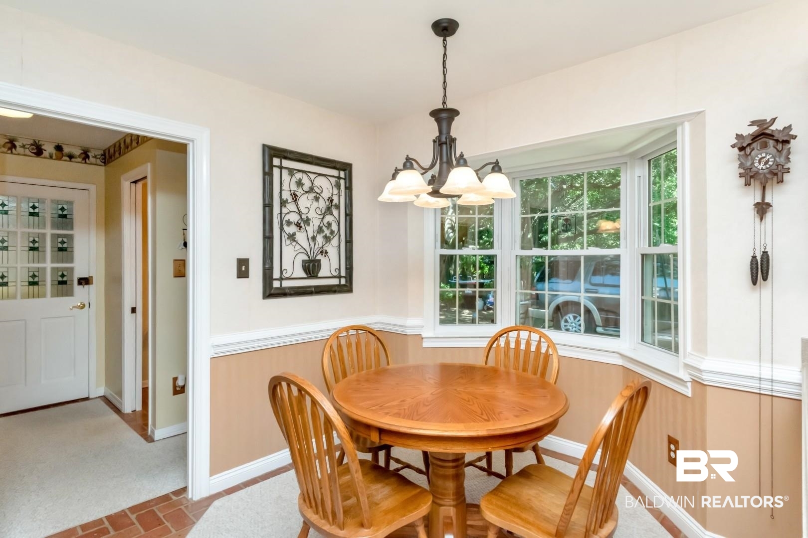8220 Fordham Road Mobile, AL 36619 - Photo 7 of 41 Dining area with brick floor, baseboards, and a notable chandelier