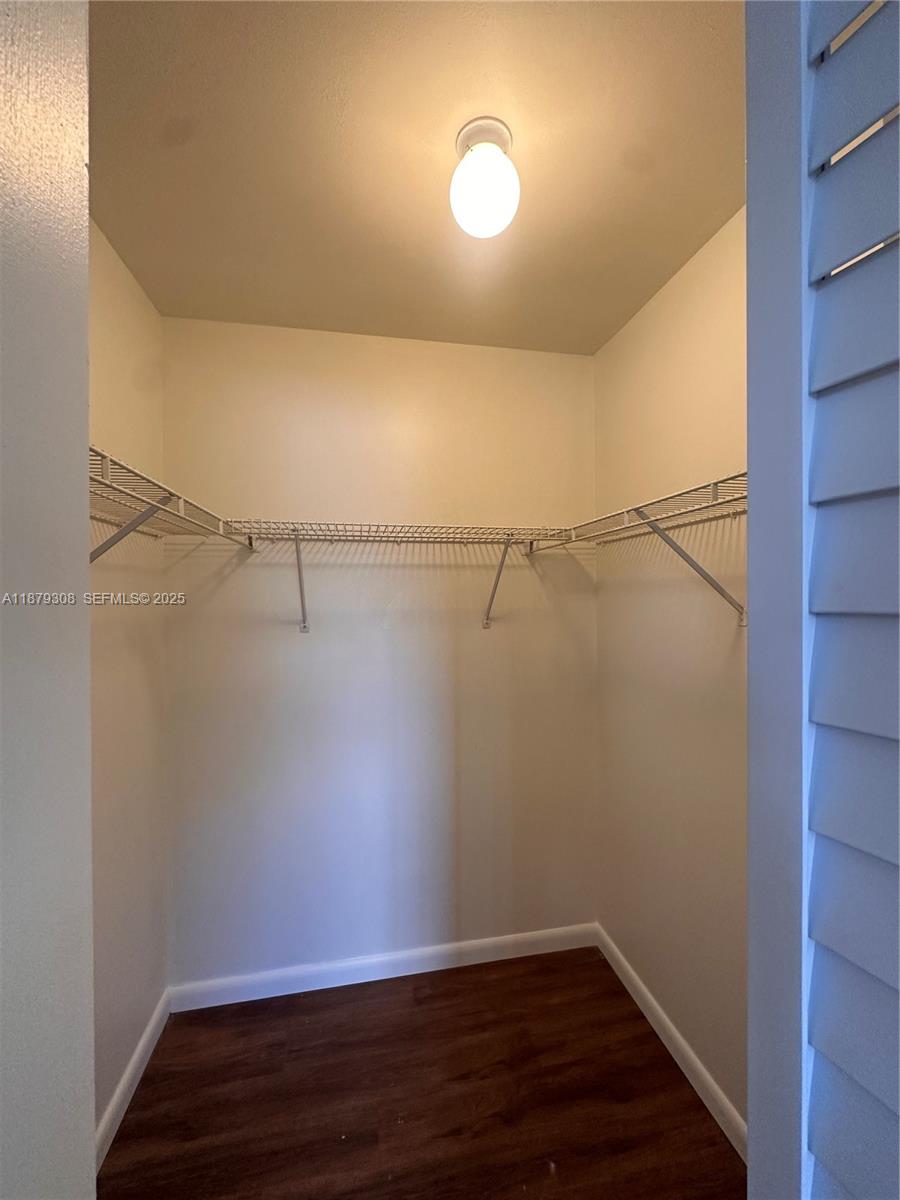 19700 Southwest 103rd Court, Unit 201 Cutler Bay, FL 33157 - Photo 13 of 21 a view of a room with wooden floor