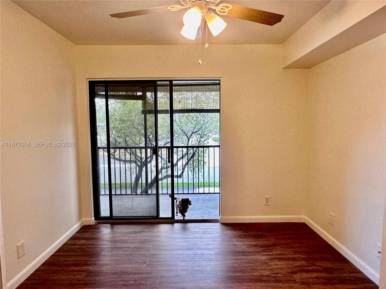 19700 Southwest 103rd Court, Unit 201 Cutler Bay, FL 33157 - Photo 17 of 21 wooden floor in an empty room with a window