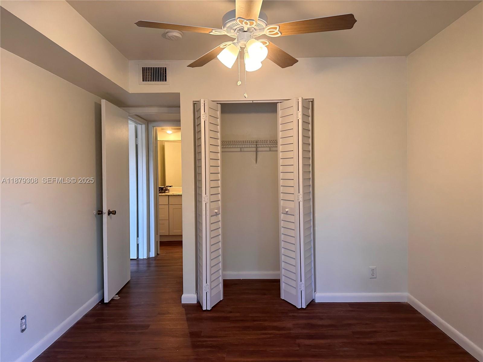 19700 Southwest 103rd Court, Unit 201 Cutler Bay, FL 33157 - Photo 18 of 21 wooden floor in an empty room with a window