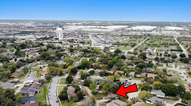 an aerial view of residential houses with outdoor space