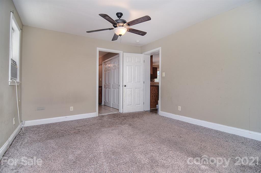 1100 Culp Street Lancaster, SC 29720 - Photo 19 of 30 an empty room with closet and ceiling fan