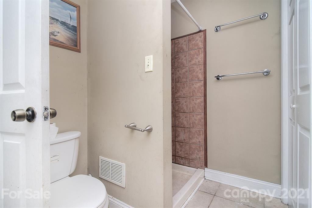 1100 Culp Street Lancaster, SC 29720 - Photo 21 of 30 a bathroom with a shower and a toilet