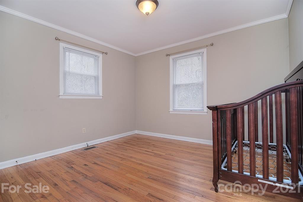 1100 Culp Street Lancaster, SC 29720 - Photo 23 of 30 a view of an empty room with wooden floor and a window