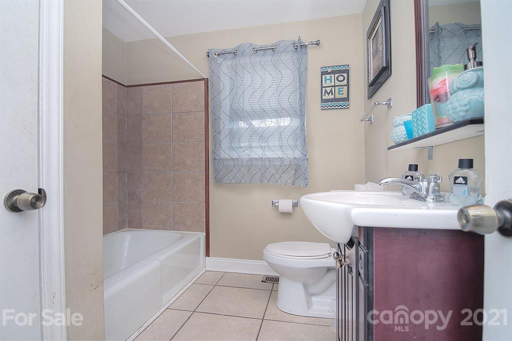 1100 Culp Street Lancaster, SC 29720 - Photo 25 of 30 a bathroom with a sink toilet and bathtub