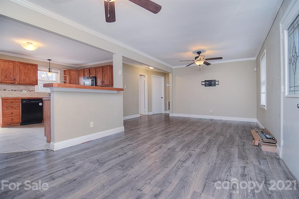 1100 Culp Street Lancaster, SC 29720 - Photo 4 of 30 a view of kitchen and entryway with wooden floor