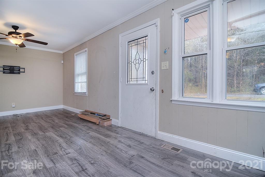 1100 Culp Street Lancaster, SC 29720 - Photo 6 of 30 a view of room with a ceiling fan and wooden floor