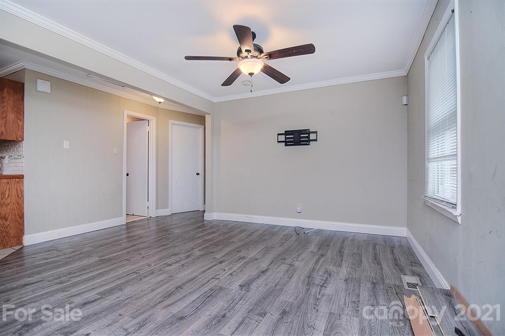 1100 Culp Street Lancaster, SC 29720 - Photo 8 of 30 wooden floor in an empty room with a window